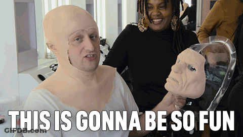Man With Mask Beside Woman Holding Mannequin Head This Is Gonna Be So Fun GIF