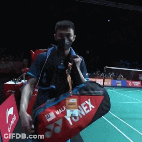 Man With Mask Carrying Yonex Bag GIF
