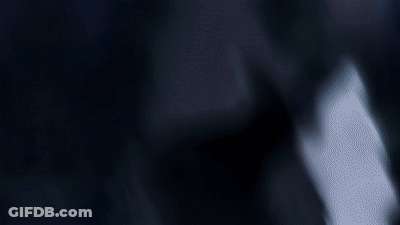 Man With Mask Looking At Camera GIF