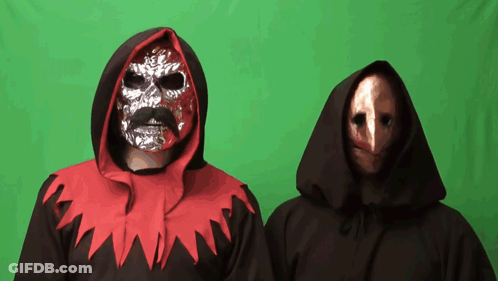 Man With Mask Next To Man In Black Robe GIF
