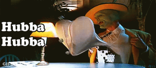 Man With Mask Sitting At Table With Lamp Saying Hubba Hubba GIF