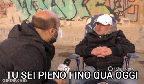 Man With Mask Talking To Another Man Tu Sei Pieno Fino Qua Oggi GIF