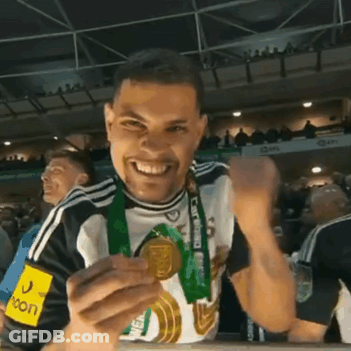Man With Medal And Moon Shirt GIF