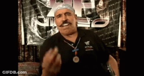 Man With Medal And Wrestlemania Shirt GIF