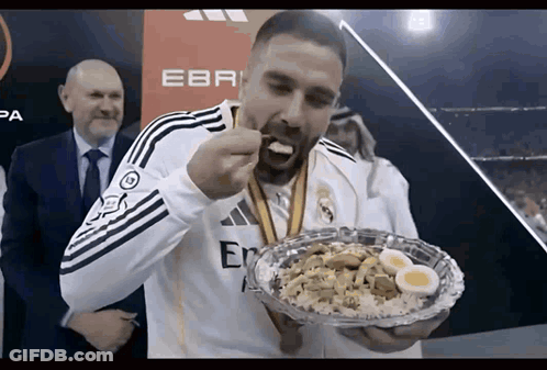 Man With Medal Eating Food GIF