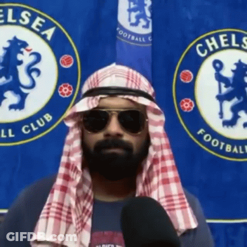 Man With Medal Holding Beer And Glass GIF