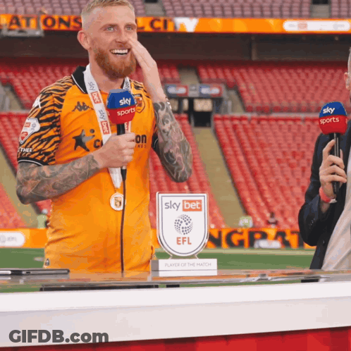 Man With Medal In Front Of Sky Sports Microphone GIF