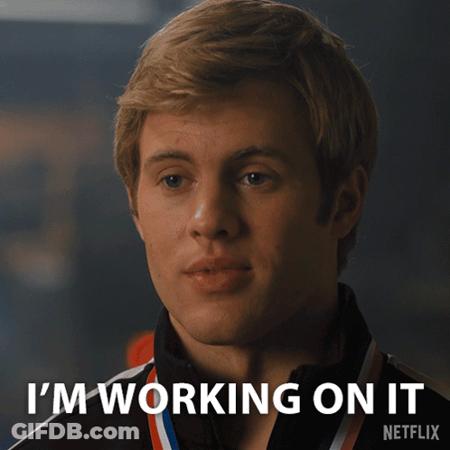 Man With Medal Says I'm Working On It GIF