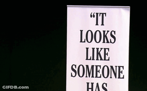 Man With Microphone Behind Sign Saying It Looks Like Someone Has GIF