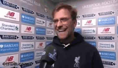 Man With Microphone In Front Of Barclays And New Balance Ads GIF