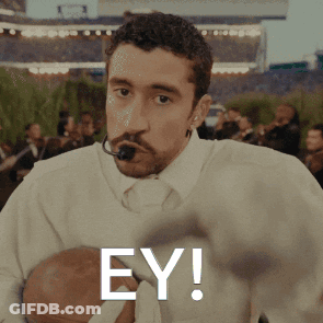 Man With Microphone In Mouth Holding Football Ey GIF