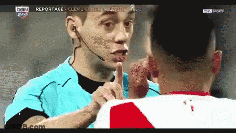 Man With Microphone On Head Talking To Man In Red And White Shirt GIF