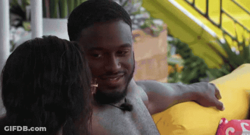 Man With Microphone Sitting Next To Woman GIF