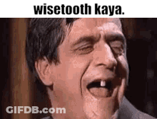 Man With Missing Tooth Making Funny Face Tongue Out GIF