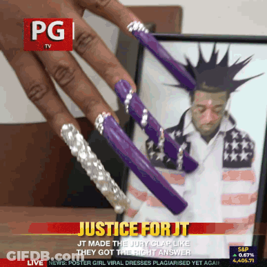 Man With Mohawk And Purple Nails On PG TV Screen GIF