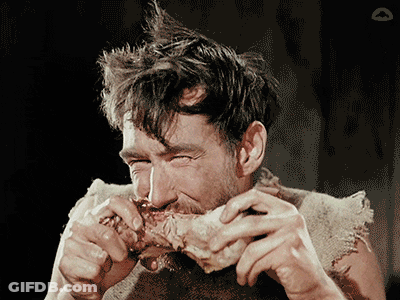Man With Mohawk Eating Meat GIF