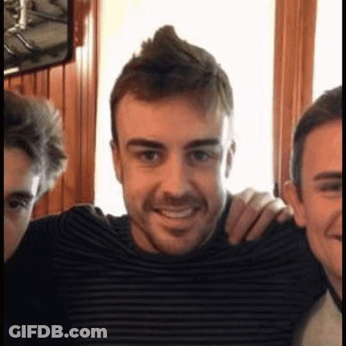Man With Mohawk Smiling With Two Men GIF