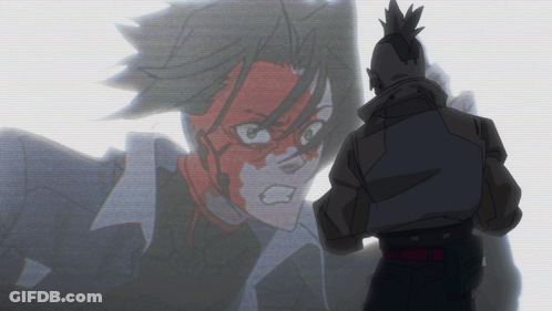 Man With Mohawk Stands In Front Of Cartoon Character GIF