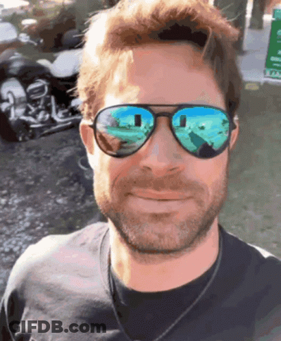 Man With Motorcycle Reflection In Sunglasses GIF