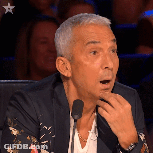Man With Mouth Open At Microphone GIF