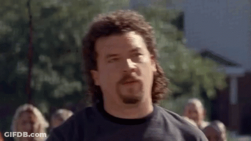 Man With Mullet And Beard In Crowd GIF