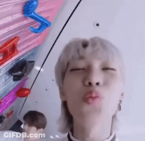 Man With Mullet Blowing A Kiss GIF