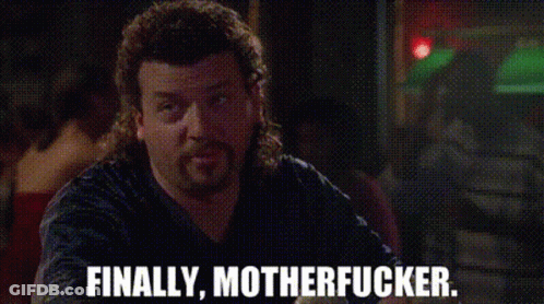 Man With Mullet Sitting At Table Saying Finally Motherfucker GIF
