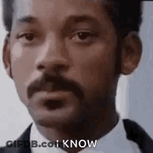 Man With Mustache And Beard In Suit And Tie GIF