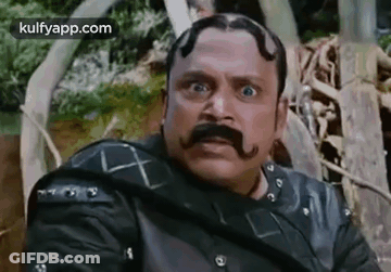 Man With Mustache And Beard Making Funny Face GIF