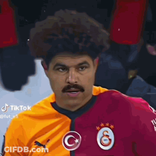 Man With Mustache And Curly Hair Wearing Puma Jersey GIF