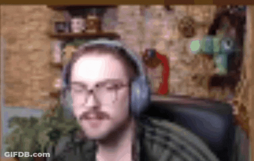 Man With Mustache And Glasses Wearing Headphones In Chair GIF