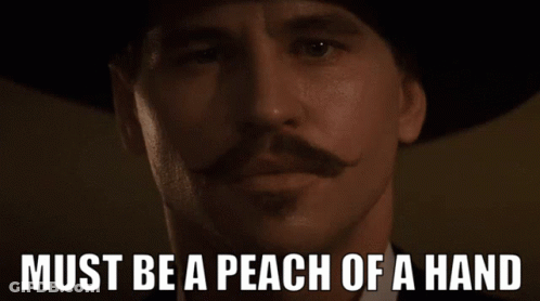 Man With Mustache And Hat Saying Must Be A Peach Of A Hand GIF