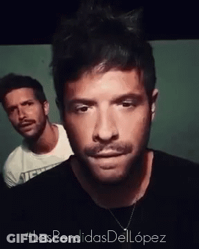 Man With Mustache And Man In White Shirt GIF