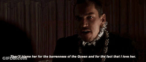 Man With Mustache And Necklace Says They'll Blame Her For The Barredness Of The Queen GIF