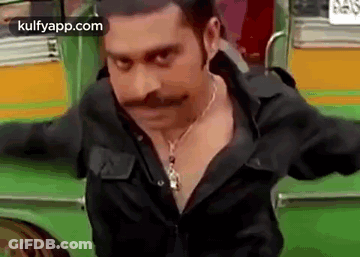 Man With Mustache And Necklace Standing Before Green Bus GIF