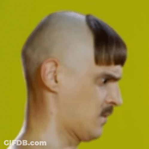 Man With Mustache And Shaved Head Making Funny Face GIF