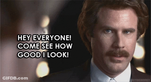 Man With Mustache And Suit Saying Hey GIF