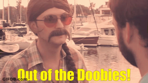 Man With Mustache And Sunglasses Says Out Of The Boobies GIF
