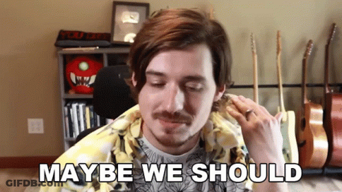 Man With Mustache At Microphone Saying Maybe We Should GIF