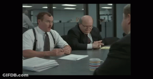 Man With Mustache At Table With Two Men In Suits GIF