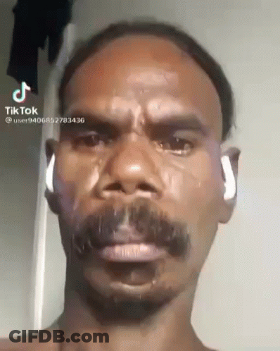 Man With Mustache Crying Wearing Earbuds GIF
