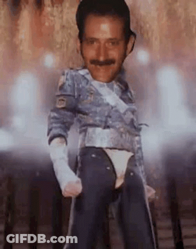 Man With Mustache Dancing On Stage In Costume GIF