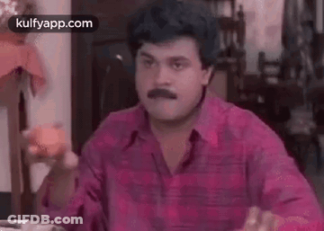 Man With Mustache Eating Apple GIF