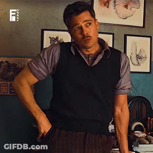 Man With Mustache Hands In Pockets In Room With Pictures GIF