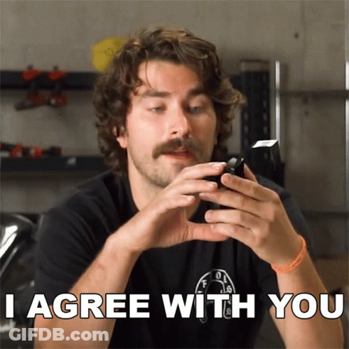 Man With Mustache Holding Cell Phone Saying I Agree GIF