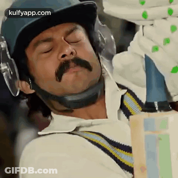 Man With Mustache Holding Cricket Bat GIF