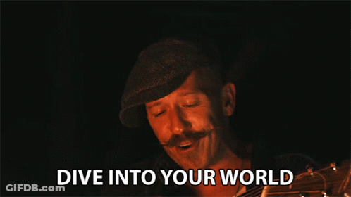 Man With Mustache Holding Guitar Says Dive Into Your World GIF