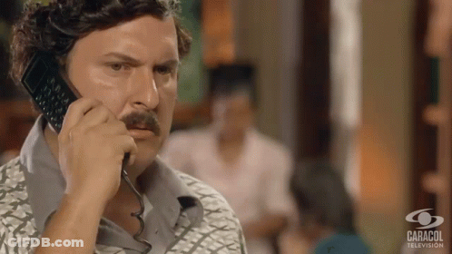 Man With Mustache Holding Milk Before Crowd GIF