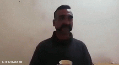 Man With Mustache Holding Tea Saying The Tea Is Fantastic GIF