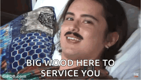 Man With Mustache In Bed Saying Big Wood Here To Service You GIF